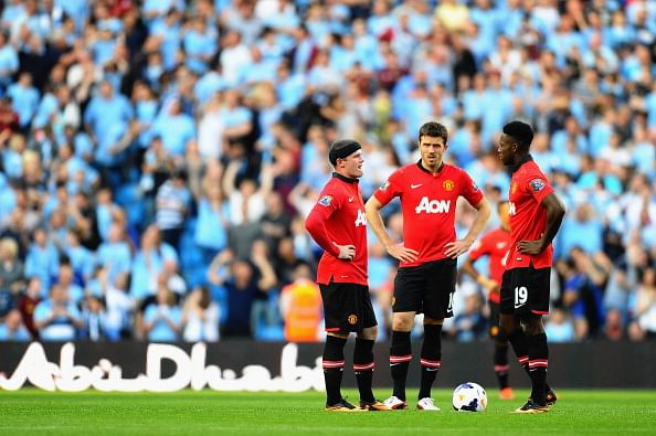 L-R) Wayne Rooney, Michael Carrick and Danny Welbeck look dejected during the Barclays Premier League match between Manchester City and Manchester United at the Etihad Stadium on September 22, 2013 in Manchester, England. (Getty Images)